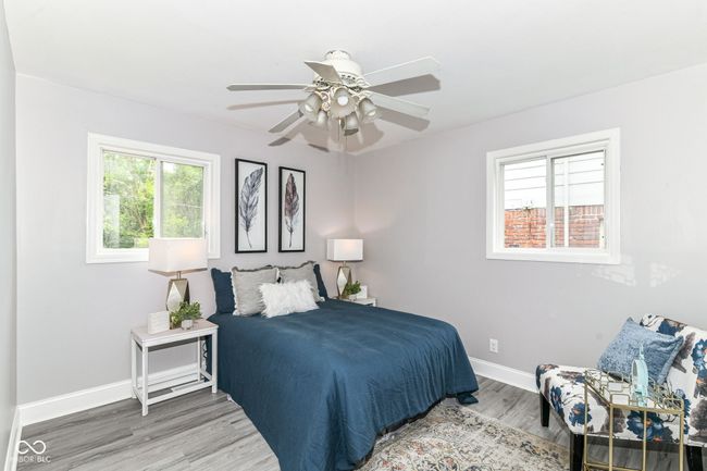 bedroom featuring baseboards, wood finished floors, and ceiling fan | Image 13