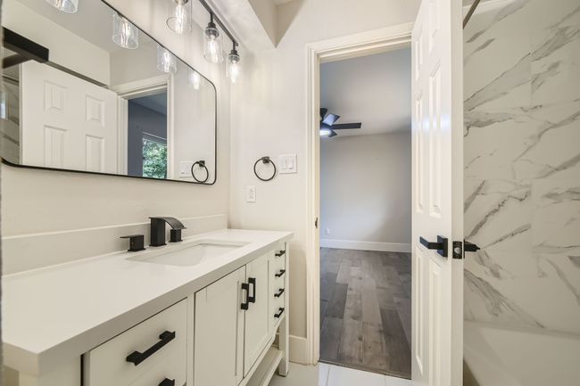 Bathroom with vanity and baseboards | Image 25
