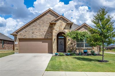 View of front of house with a garage and a front lawn | Image 1