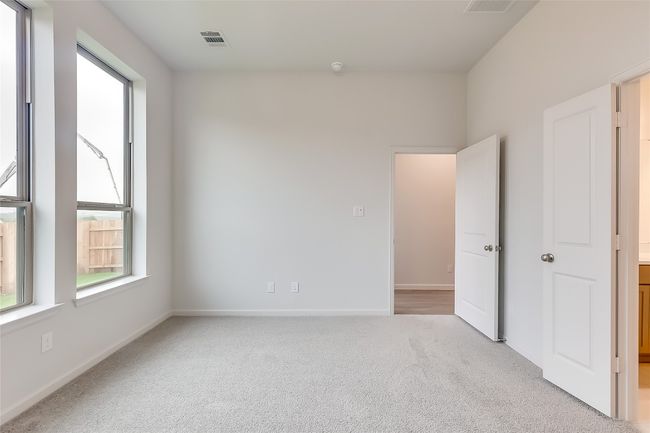 Unfurnished bedroom featuring carpet floors and baseboards | Image 18