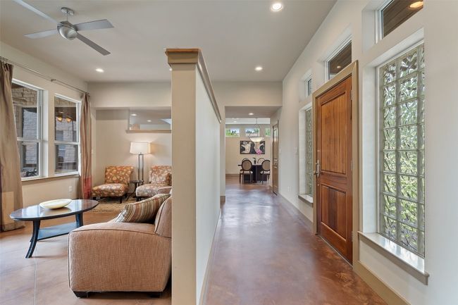 Foyer featuring recessed lighting, a ceiling fan, finished concrete floors, and baseboards | Image 12