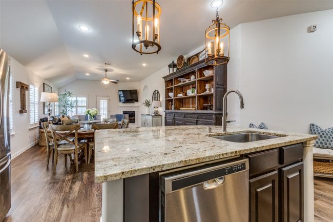 Beautiful chandeliers over kitchen island. | Image 13