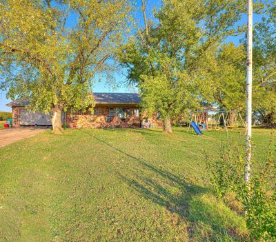 View of yard with a playground | Image 2