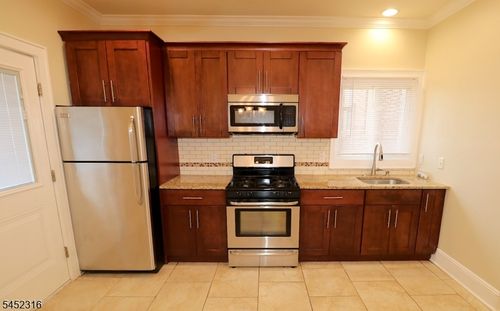 r1-93 Nichols St, Newark, NJ, 07105-1611 | Card Image