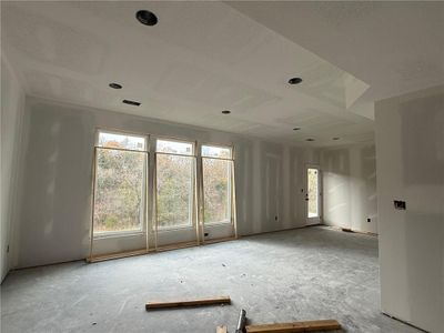 Large living room with three windows provided just the right amount of natural light. | Image 2