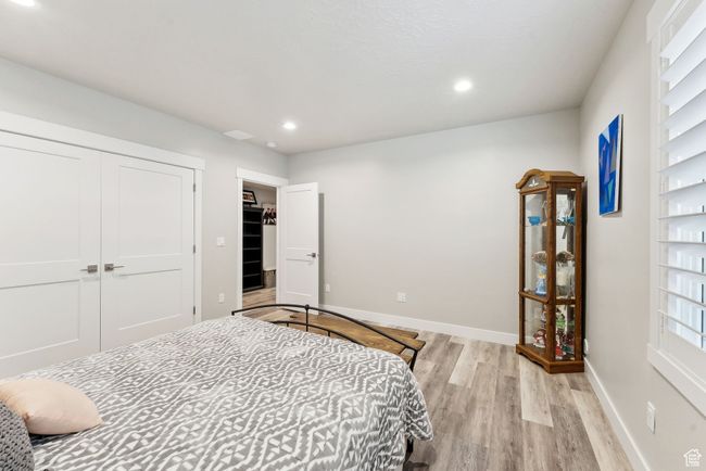 Bedroom with recessed lighting, light wood-style flooring, and baseboards | Image 28