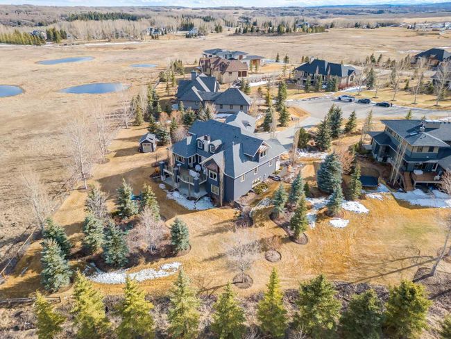 36 Mackenas Way, Home with 5 bedrooms, 4 bathrooms and 6 parking in Rural Rocky View County AB | Image 6