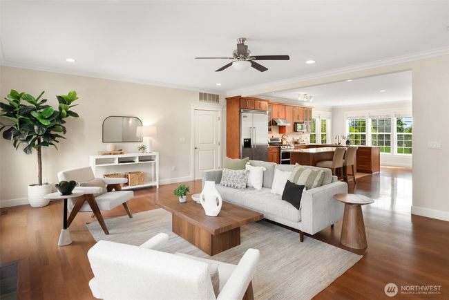 Family room looking back towards the kitchen. Oversized tandum garage through the door to the left of the refrigerator | Image 13