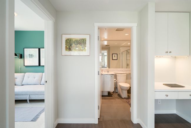 Hall with dark wood finished floors and baseboards | Image 15