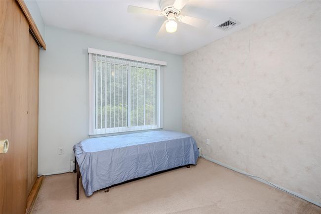 Bedroom featuring carpet and a closet | Image 29