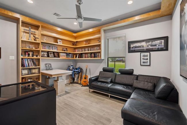 Dedicated workspace perfect for a home office or study area. | Image 24