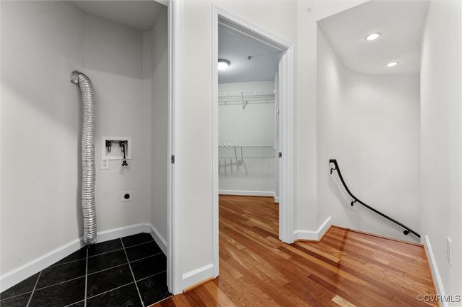 Hall with recessed lighting, wood finished floors, baseboards, and an upstairs landing | Image 24