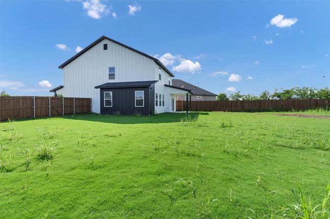 Back of house with board and batten siding | Image 38