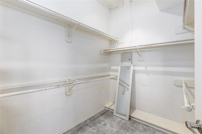 This spacious walk-in closet has space for all of your clothes! | Image 28