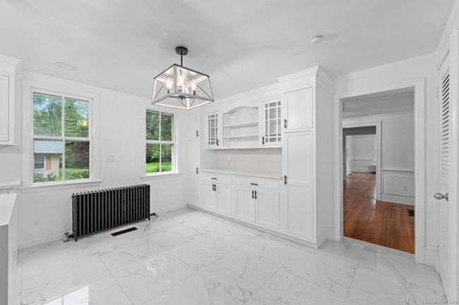 The spacious kitchen will accommodate a table &amp; 6 chairs comfortably for informal dining. | Image 10