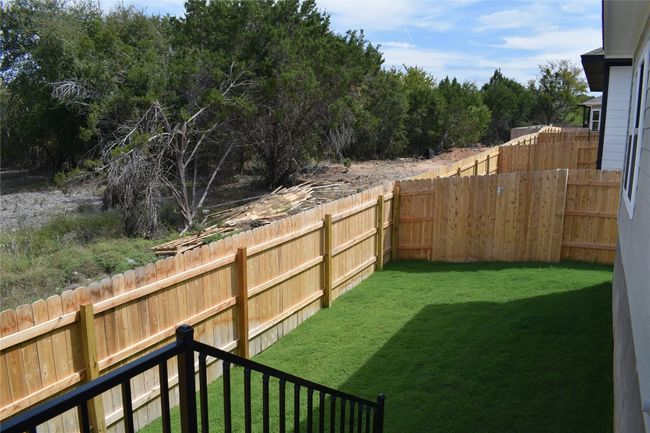 View of fenced backyard | Image 22