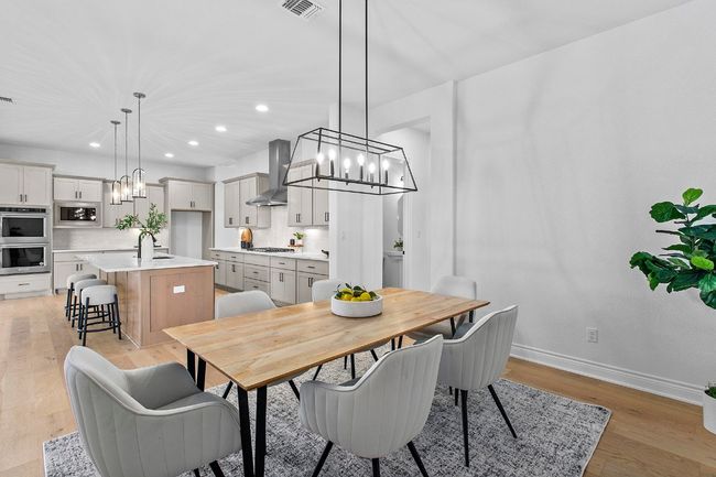 Dining space with a chandelier, recessed lighting, and light wood-type flooring | Image 12