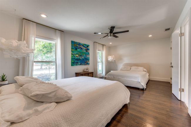 Bedroom with dark wood-style flooring, multiple windows, recessed lighting, ceiling fan, and baseboards | Image 22
