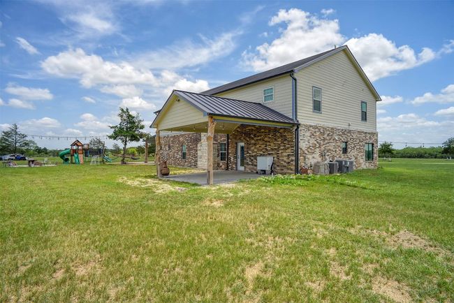 Back of property showing a covered patio | Image 38