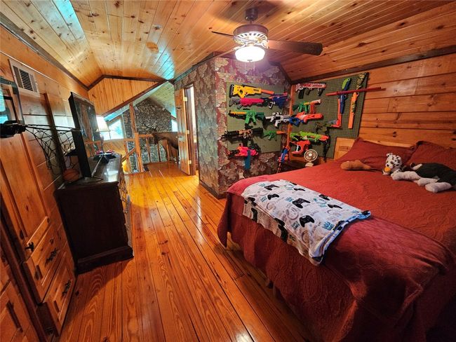 Open Upstairs Bedroom/Bathroom Suite. Note how the Wooden Ceilings flow together in this home! | Image 31