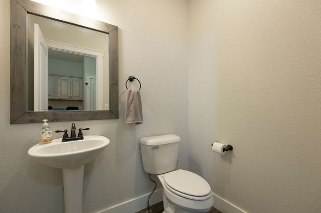 Bathroom featuring baseboards and toilet | Image 18