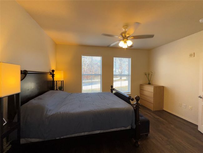 Bedroom featuring dark wood-type flooring and ceiling fan | Image 28