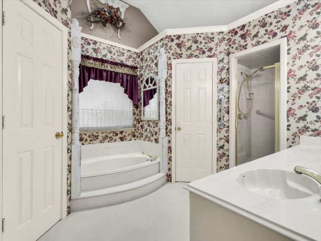 Large soaking tub is perfect for relaxing after a long day. | Image 28