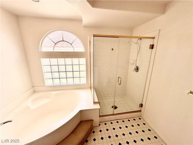 Full bath featuring a garden tub and a stall shower | Image 25