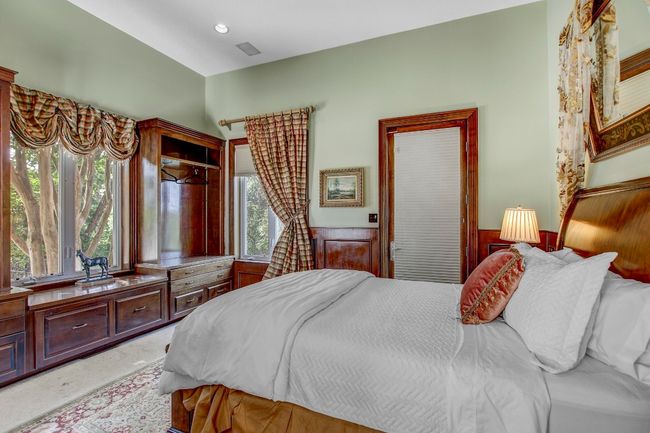 Bedroom featuring a wainscoted wall and multiple windows | Image 22