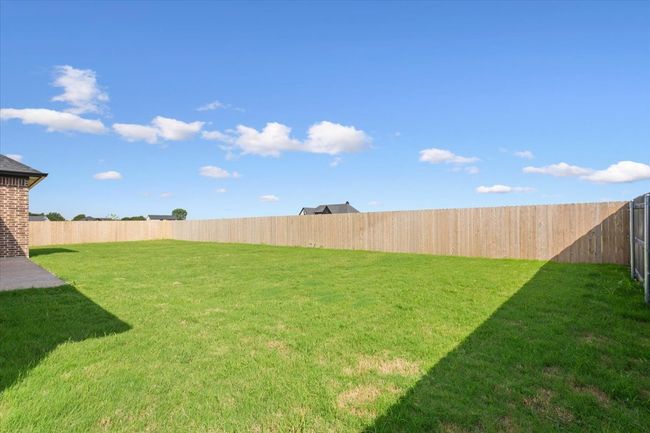 View of fenced backyard | Image 37