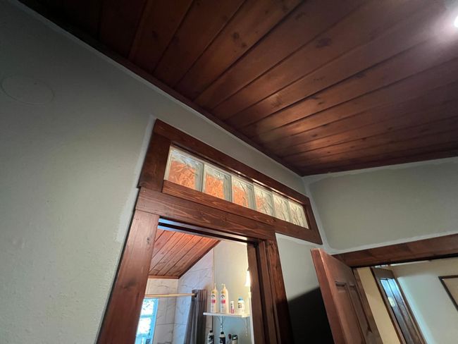 Leaded glass above the primary bathroom adds history and charm | Image 26