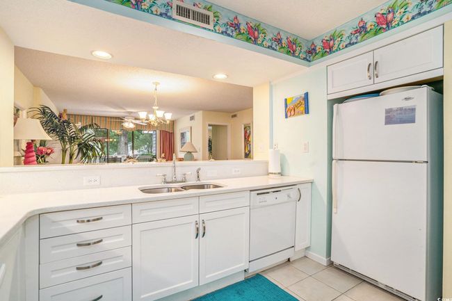 Updated kitchen cabinets, quartz countertops and newer fixtures | Image 10