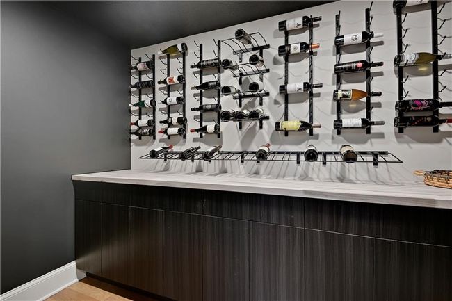 Wine area with baseboards | Image 50