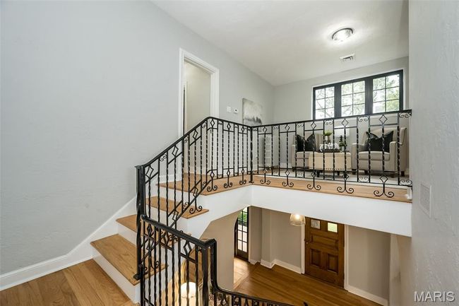 Stairway featuring wood finished floors and baseboards | Image 20