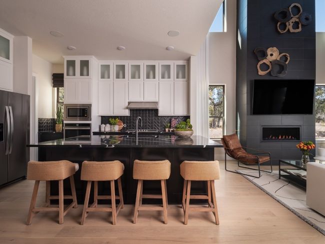 Kitchen featuring appliances with stainless steel finishes, dark countertops, healthy amount of natural light, and decorative backsplash | Image 4