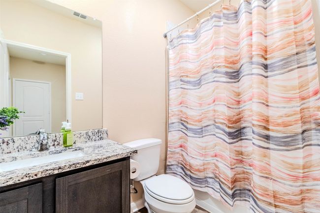 Full bathroom featuring vanity, toilet, and shower / tub combo | Image 16