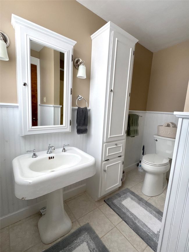 Bathroom featuring toilet and tile patterned flooring | Image 34