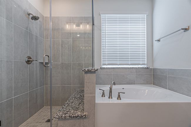 Full bath with a shower stall and a bath | Image 27