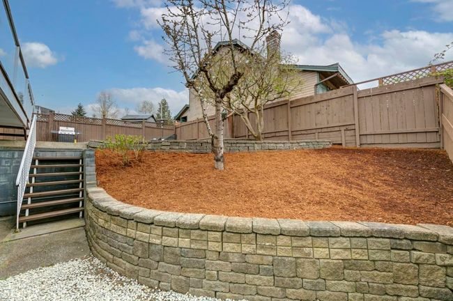 View of yard with a fenced backyard and stairs | Image 36
