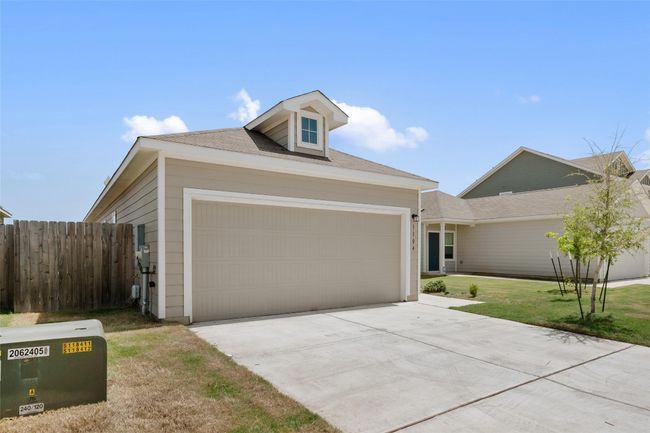 View of front of home featuring an attached garage and driveway | Image 4