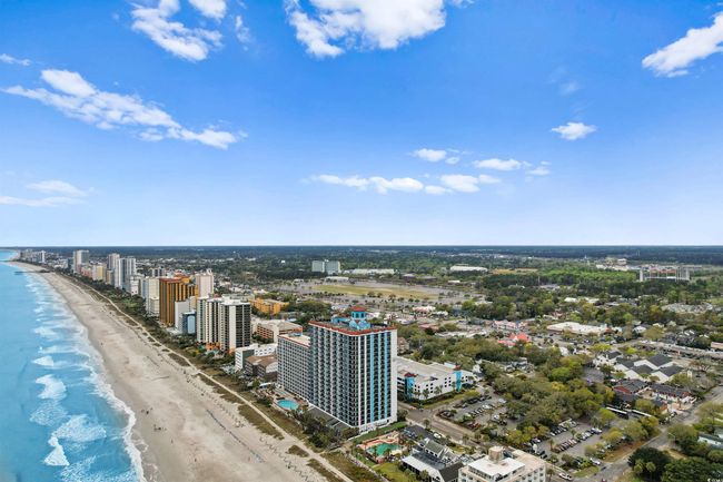 View of urban area with waterfront with a beach | Image 38