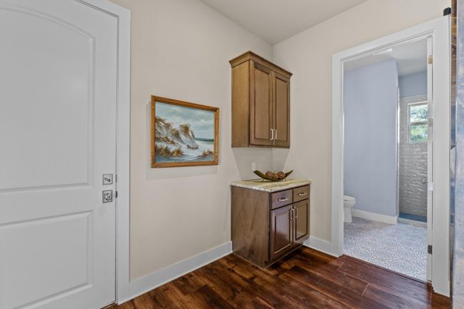 Corridor with baseboards and dark wood-style flooring | Image 30