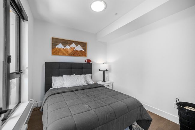 Bedroom featuring dark wood finished floors and baseboards | Image 9