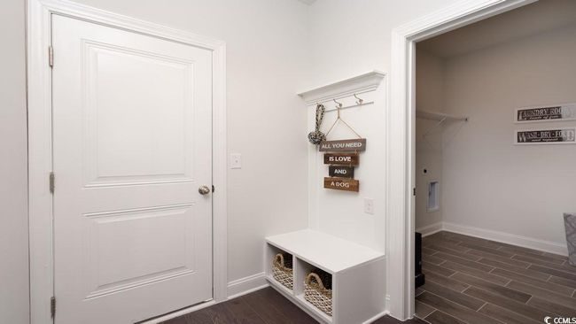 Mudroom featuring baseboards and dark wood-type flooring | Image 32