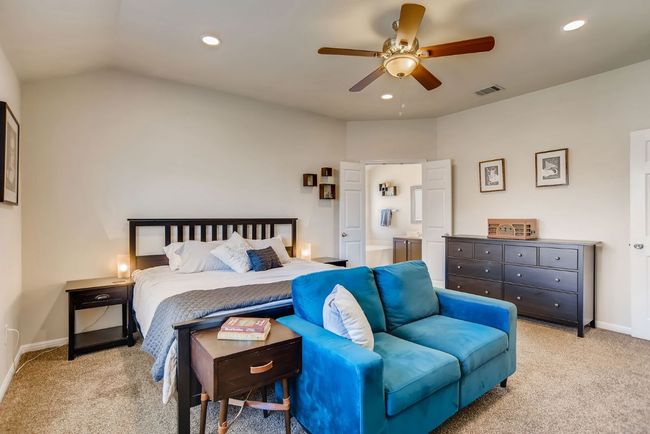 Carpeted bedroom with recessed lighting, a ceiling fan, ensuite bath, and vaulted ceiling | Image 17