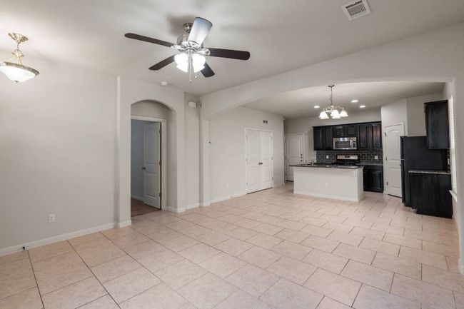 The door to the left of the kitchen leads to the 2-car garage with alley access. | Image 20