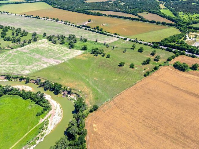 View of property location featuring rural landscape, extensive farmland, and a pastoral area | Image 5
