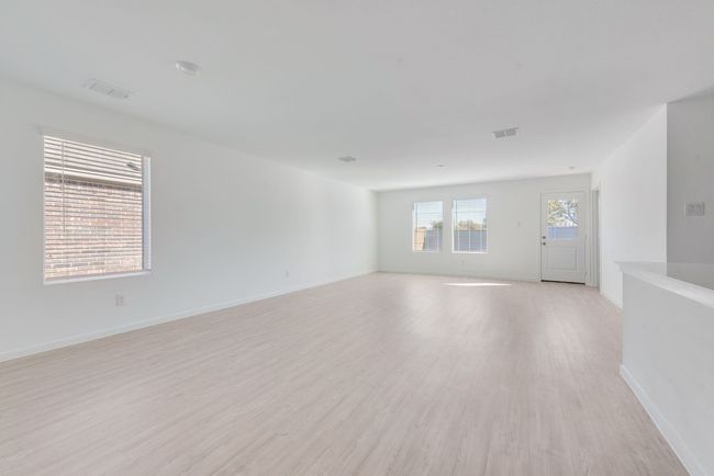 Unfurnished room with light wood-style floors and baseboards | Image 4