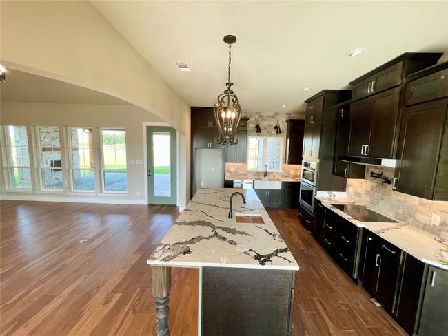 View from dining room of kitchen and living area | Image 14