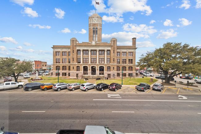 Hallway featuring wood finished floors, a drop ceiling, and recessed lighting | Image 12